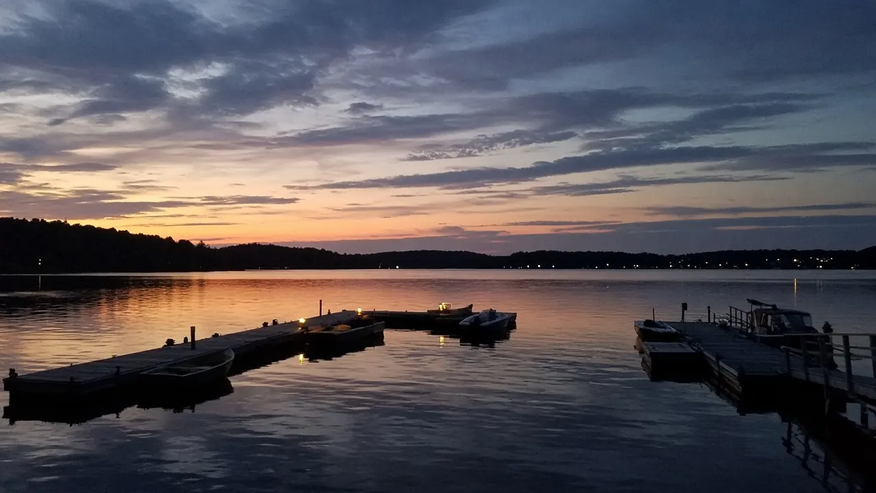 Empty docks on calm water at dusk